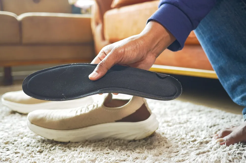shoes designed for flat feet  A row of supportive shoes recommended for flat feet, including Brooks, New Balance, Vionic, and Hoka models.