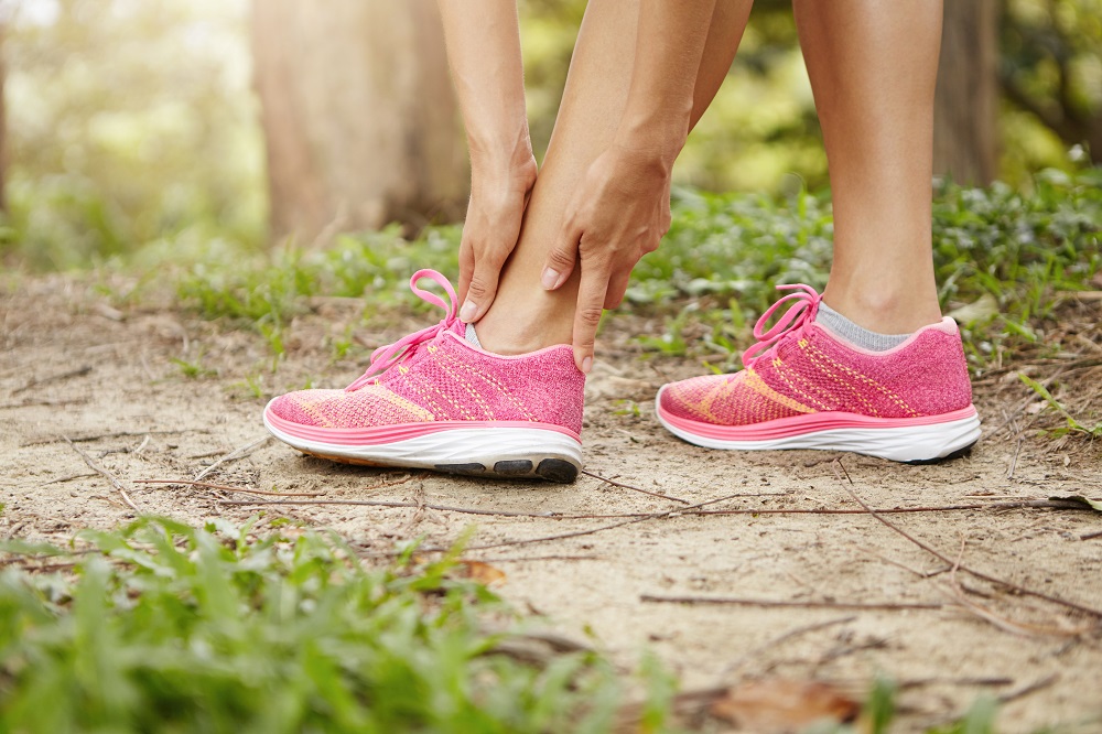 A close-up photo of a patient's ankle at a WeTreatFeet Podiatry office. The patient has peroneal tendonitis, a condition causing inflammation and pain on the outer side of the ankle.