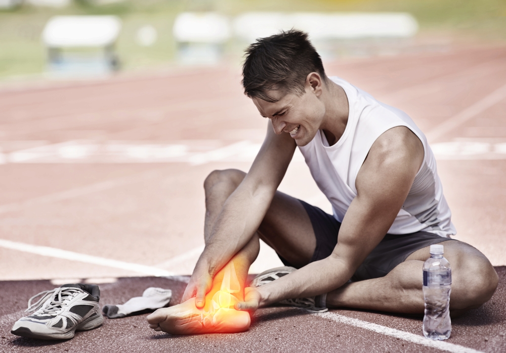 Patient with heel pain seeking expert care at WeTreatFeet Podiatry. The image depicts a concerned individual holding their heel, emphasizing the need for professional foot and ankle treatment. WeTreatFeet Podiatry offers comprehensive services, including wound care, surgery, orthotics, and gait analysis. 🦶🏥