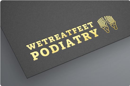 Podiatrist: Gold foil lettering reading 'WETREATREET PODIATRY' with two foot icons on black textured mat